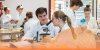 High School Information Night, students in science lab in lab coats